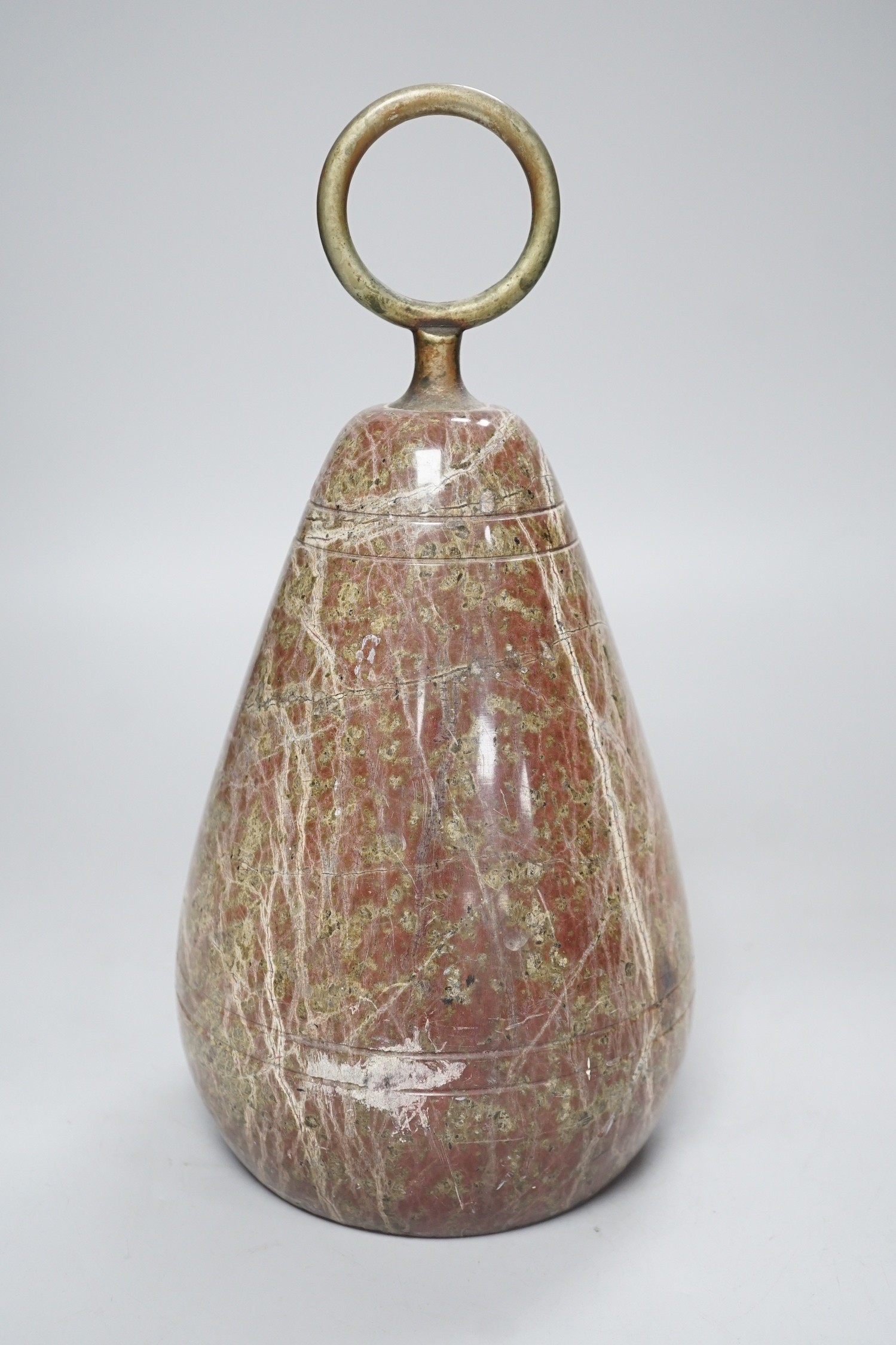 A polished serpentine doorstop. 21cm tall